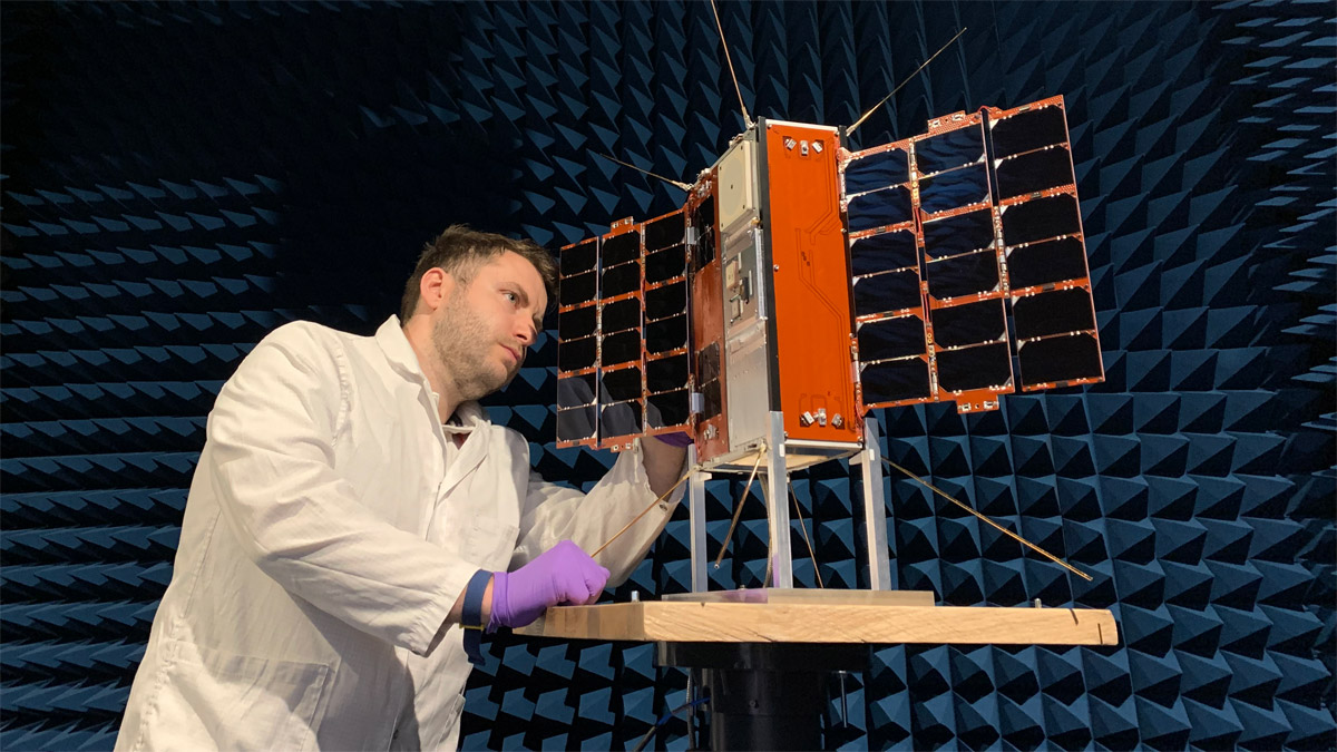 BAE Systems employee with Prometheus satellite in anechoic chamber