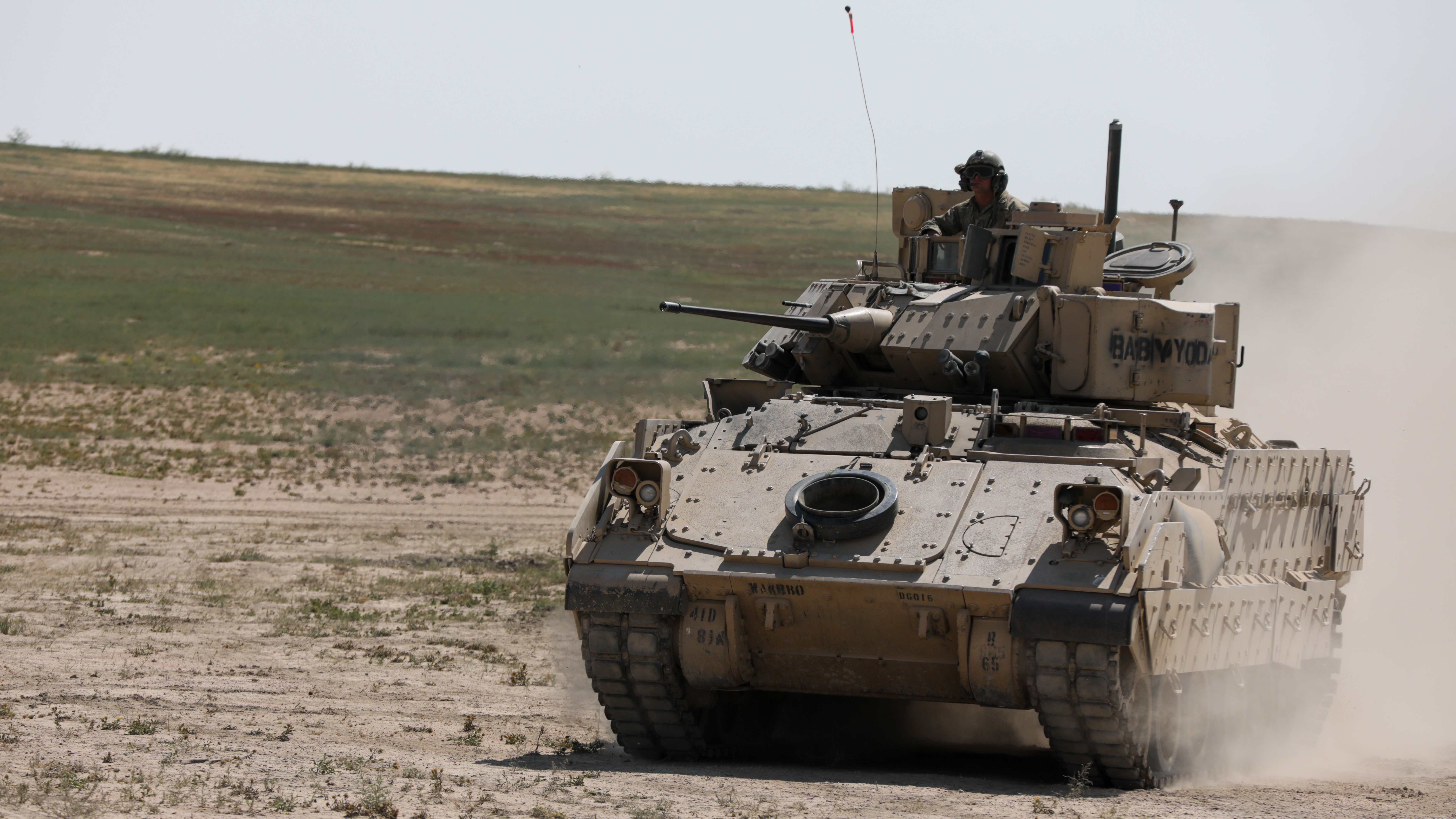 A M2A3 Bradley Infantry Fighting Vehicle moves into position during a live fire exercise
