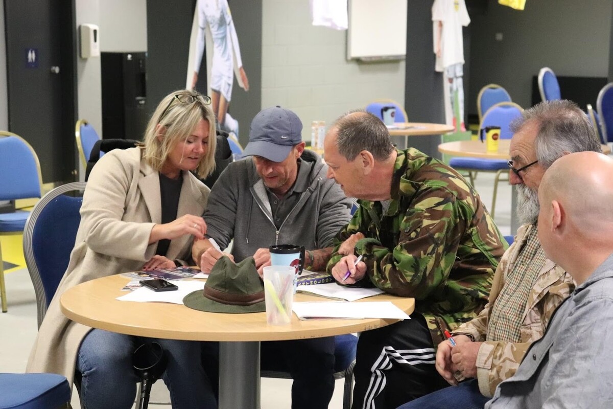 Veterans sit around a table in the Hull 4 Heroes centre
