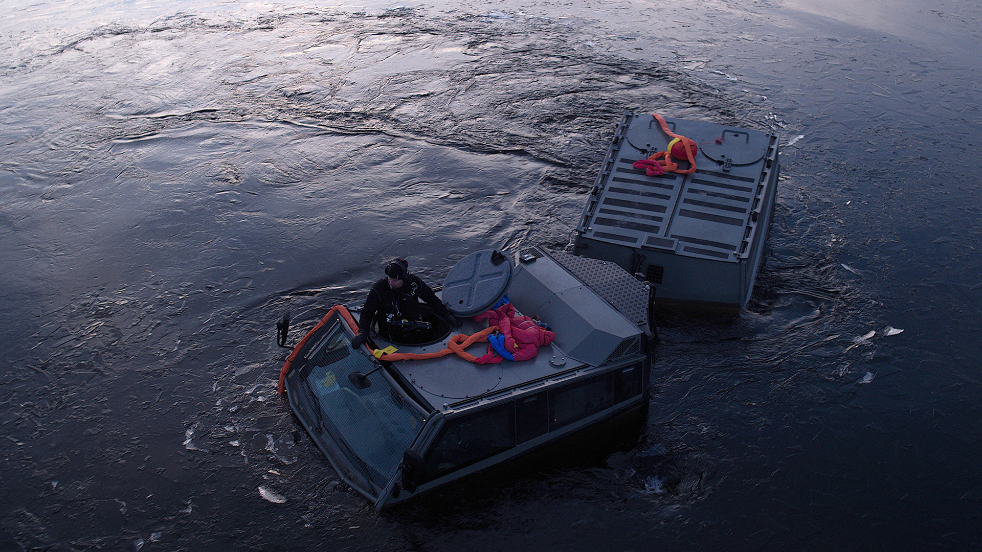 A man sits on a Beowulf in the water