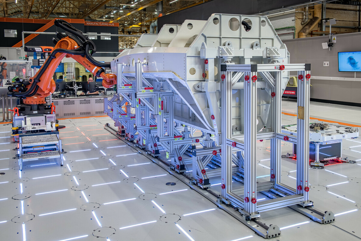 Robotic arms working on the manufacture of a fast jet fuselage in the Factory of the Future