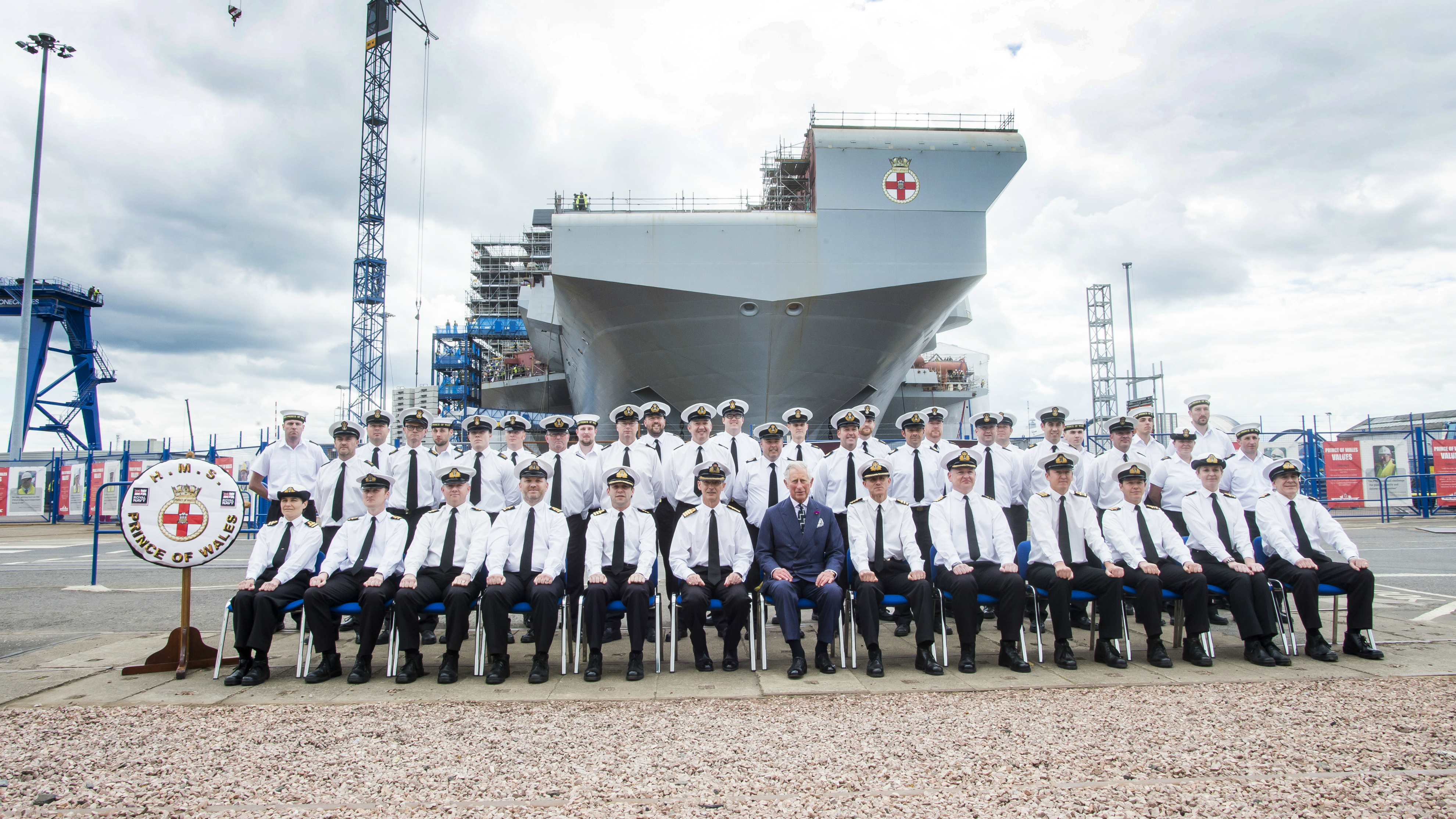 HRH Prince Charles places the final section of HMS Prince of Wales