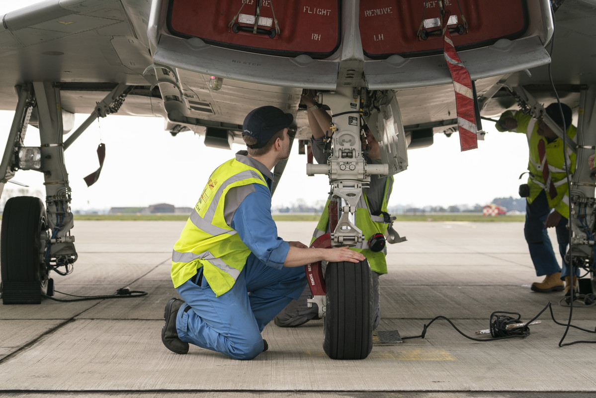 Support engineer maintaining a UK Royal Air Force Typhoon wheel at RAF Coningsby