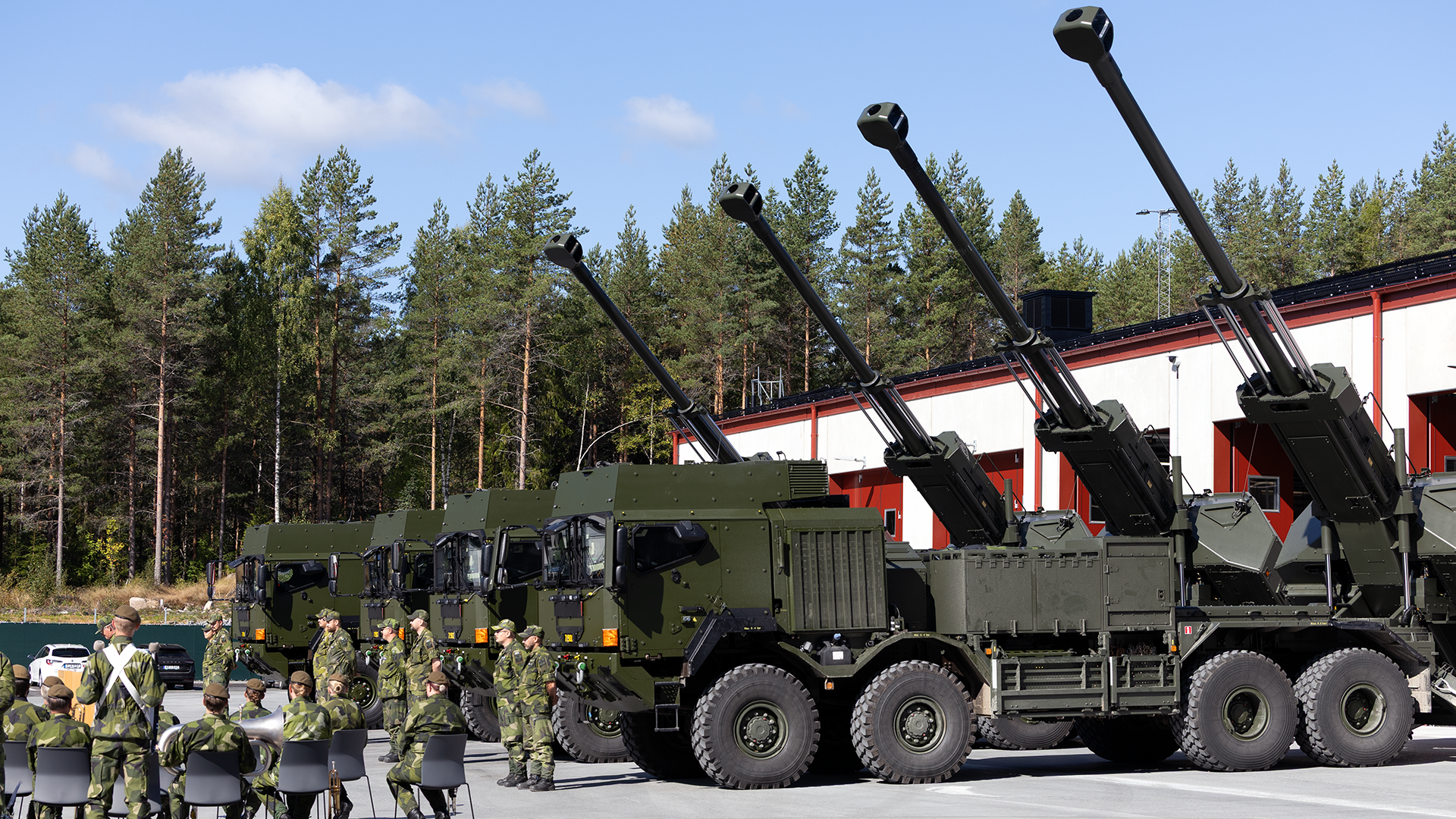 Four ARCHER 8x8 standing in front of crowd from the Swedish Armed Forces