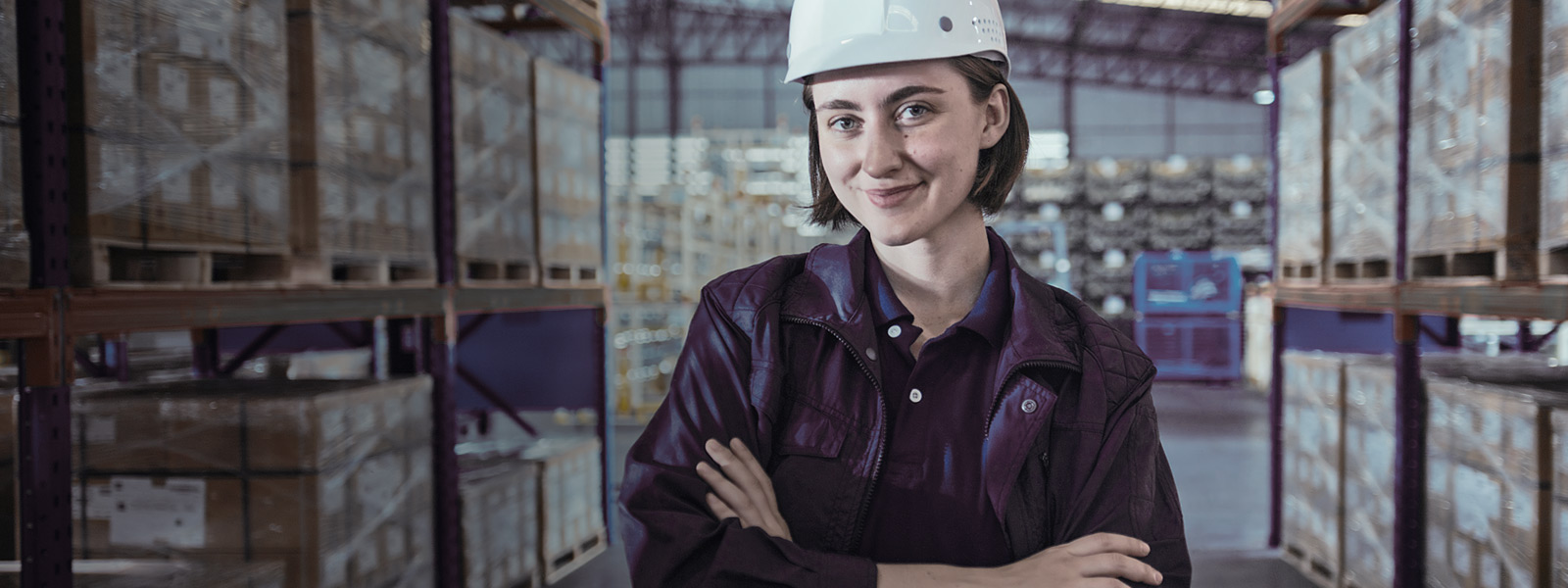 Worker in hard hat in distribution centre