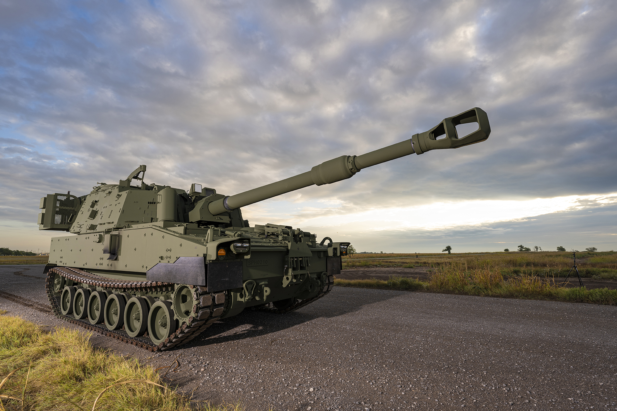 M109A7 Paladin with a sunset sky behind it.