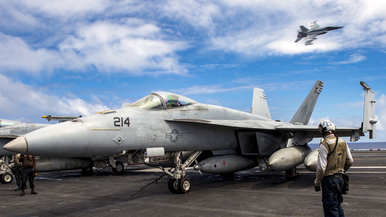 Capt. Doug Verissimo, commanding officer of the aircraft carrier USS Carl Vinson (CVN 70), conducts pre-flight checks in an F/A 18E Super Hornet from the Kestrels of Strike Fighter Squadron (VFA) 137.