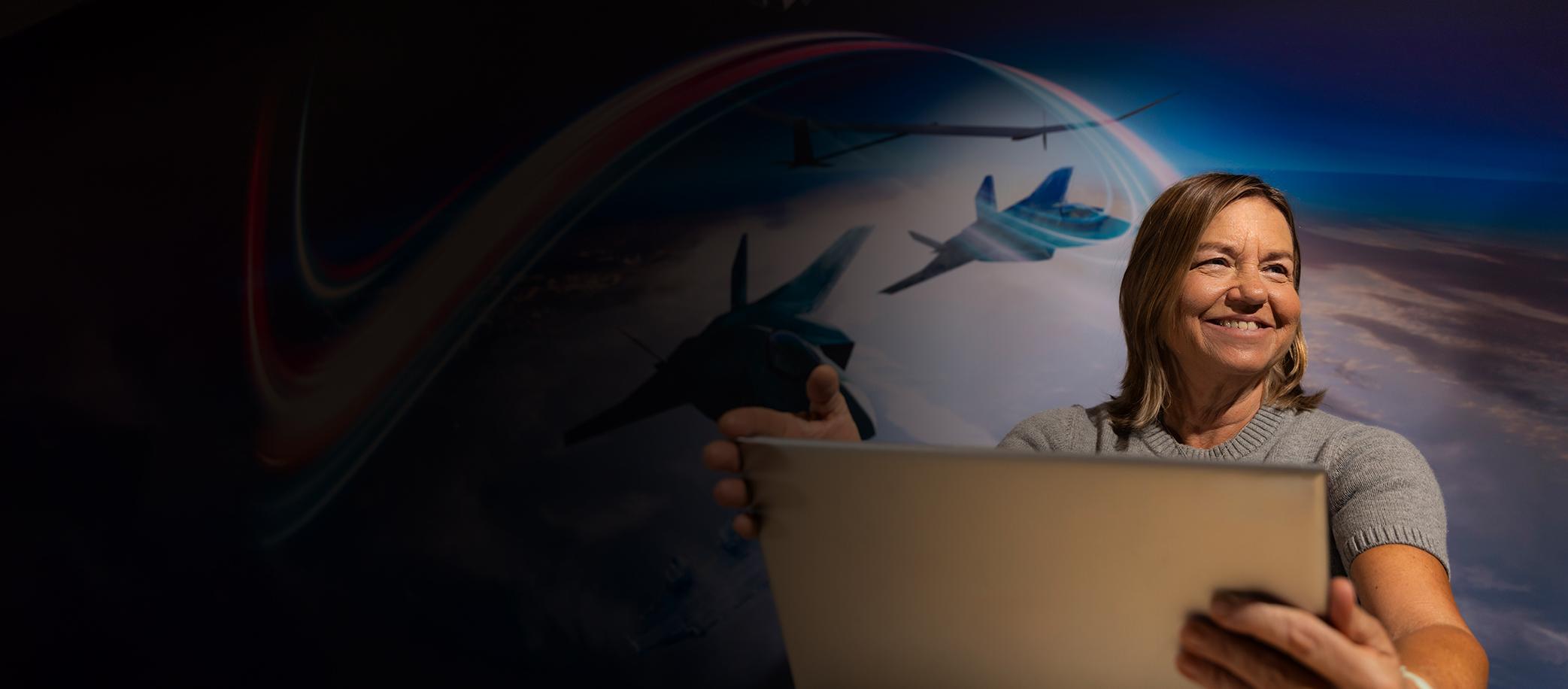 Smiling woman at laptop