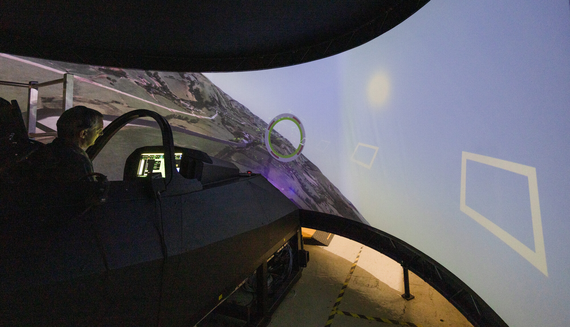 Testing engineer sat inside combat air demonstrator simulator