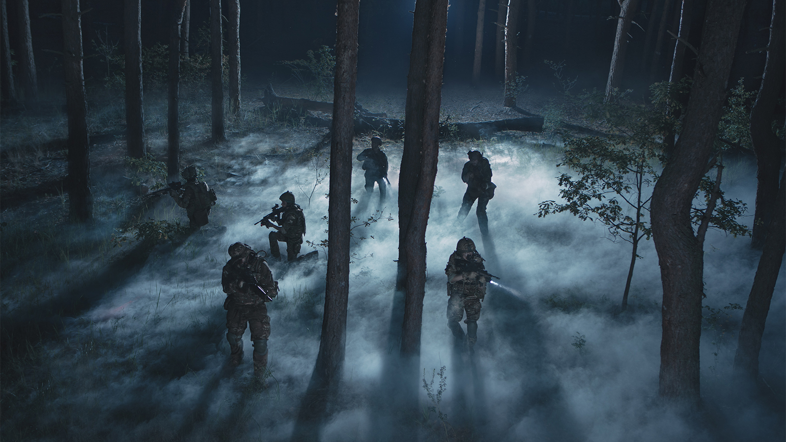 Soldiers execute a mission in low-light conditions.