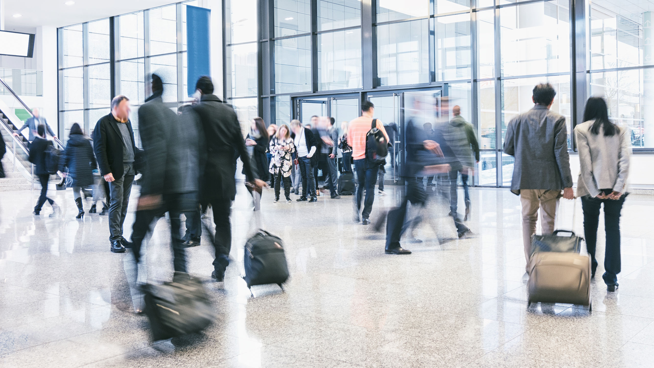 modern image showing passenger movement in a busy airport 