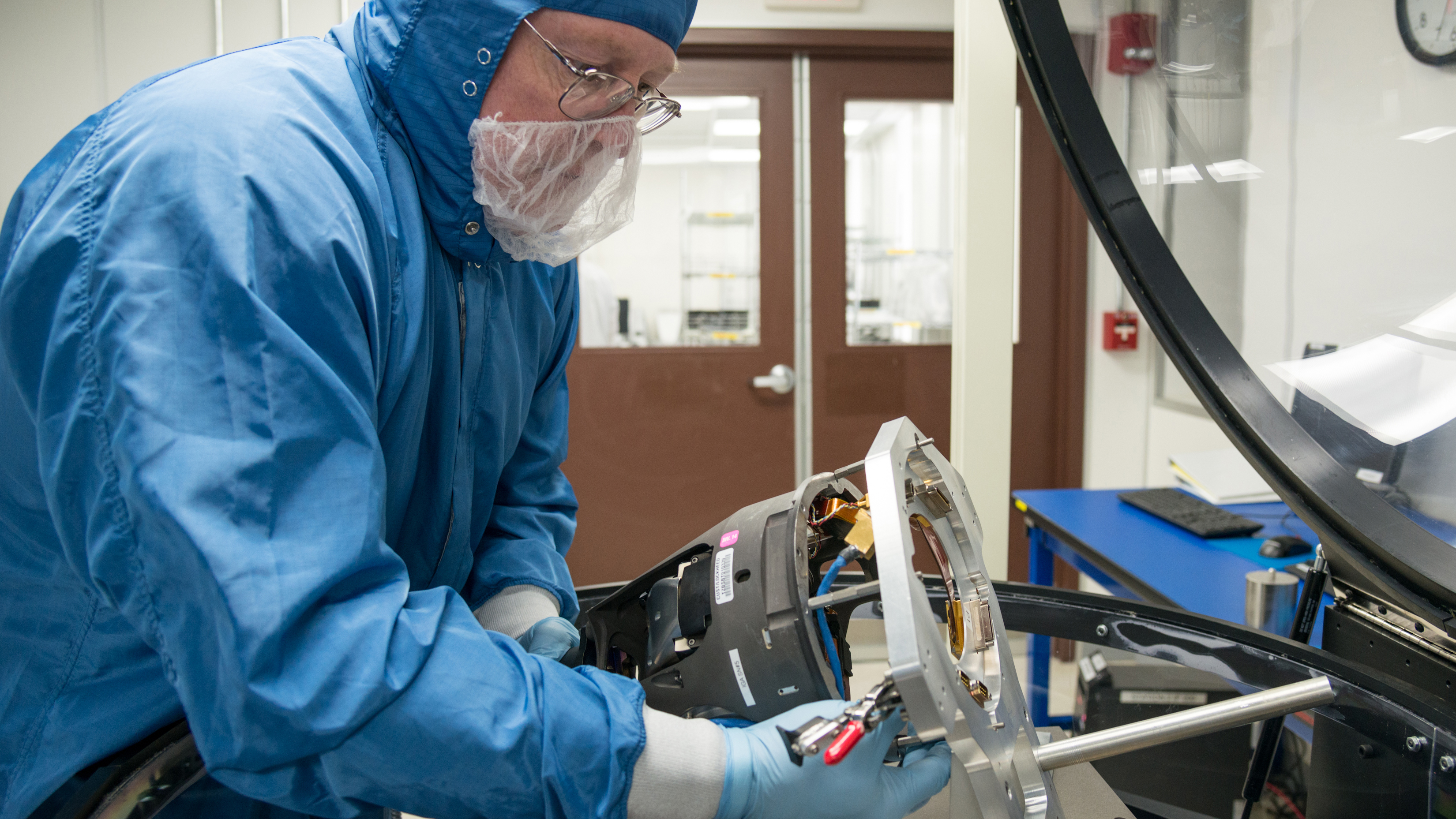 Person working on missile seeker in lab