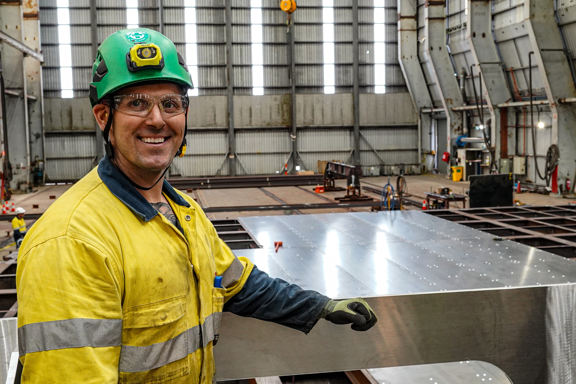 Shipbuilder at Henderson Shipyard working on the Hunter mast