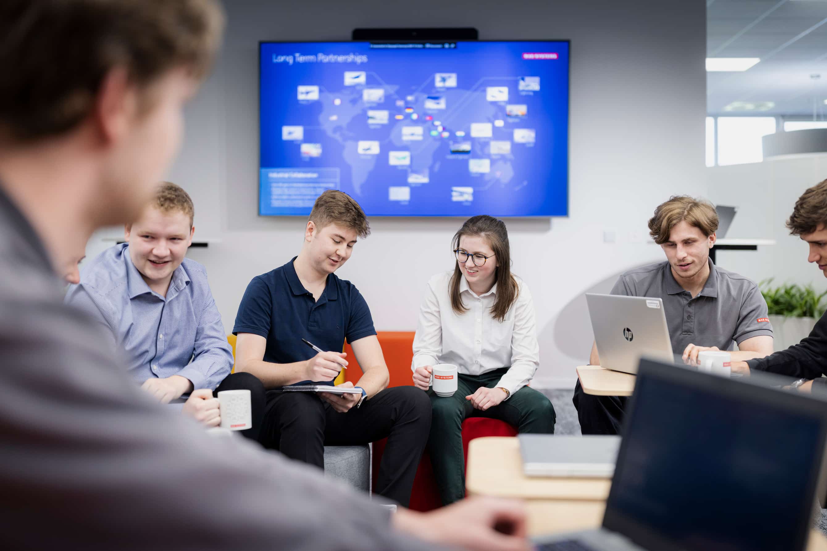 Young people collaborating in a BAES workspace