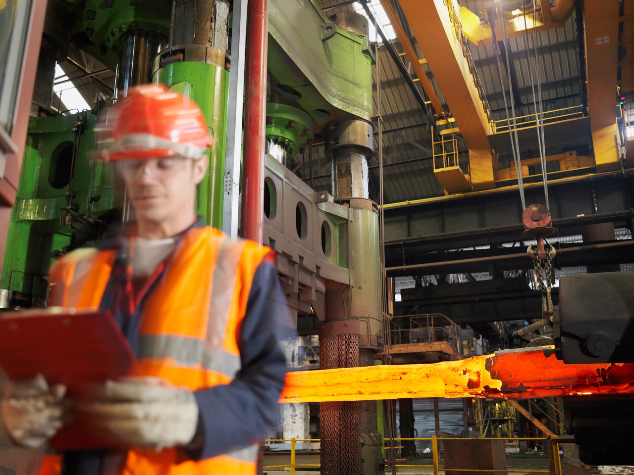 Gun barrels being forged in a factory