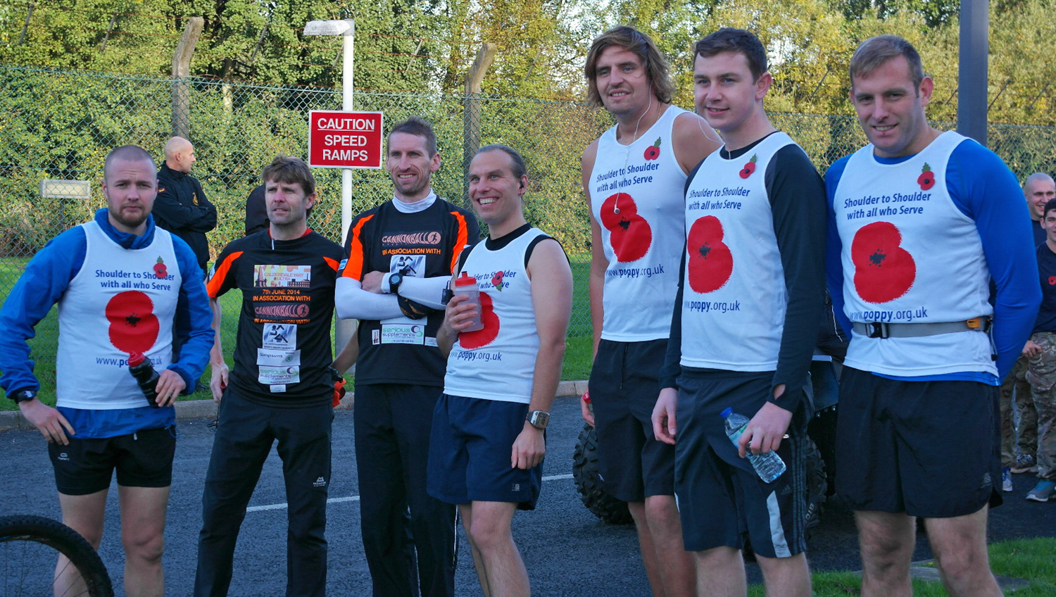 L_R (white vests) Dave Moretta, Nik Barnett, James Harwood, JOnathan Barrow and David Wild from BAE Systems taking part in the marathon