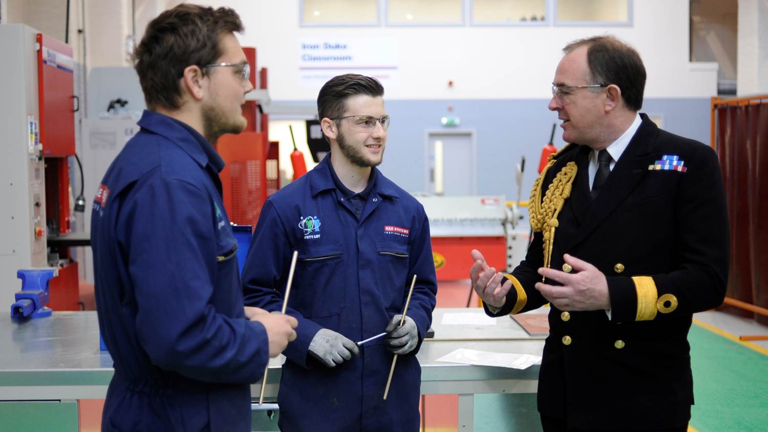 Naval Base Commander (Portsmouth), Commodore Jeremy Rigby, speaks to BAE Systems apprentices during a tour of the reopened Skills Development Centre