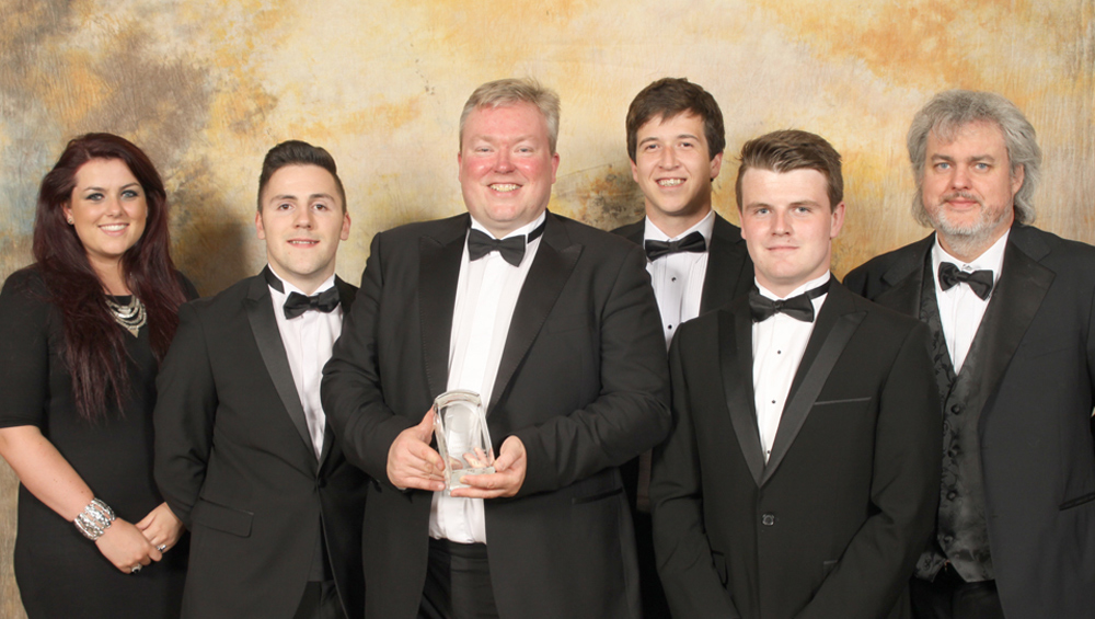 Mike Hammond, chief executive of the Queen Elizabeth’s Hospital Birmingham charity, (third from left) is presented with a Chairman's Award by the Bedflex team.