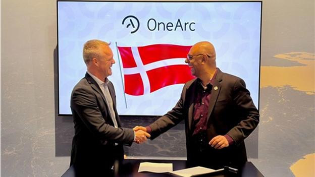 OneArc president Rahul Thakkar (Right) shakes hands with Danish Major Alex Voss, Branch Chief of Simulation Systems.