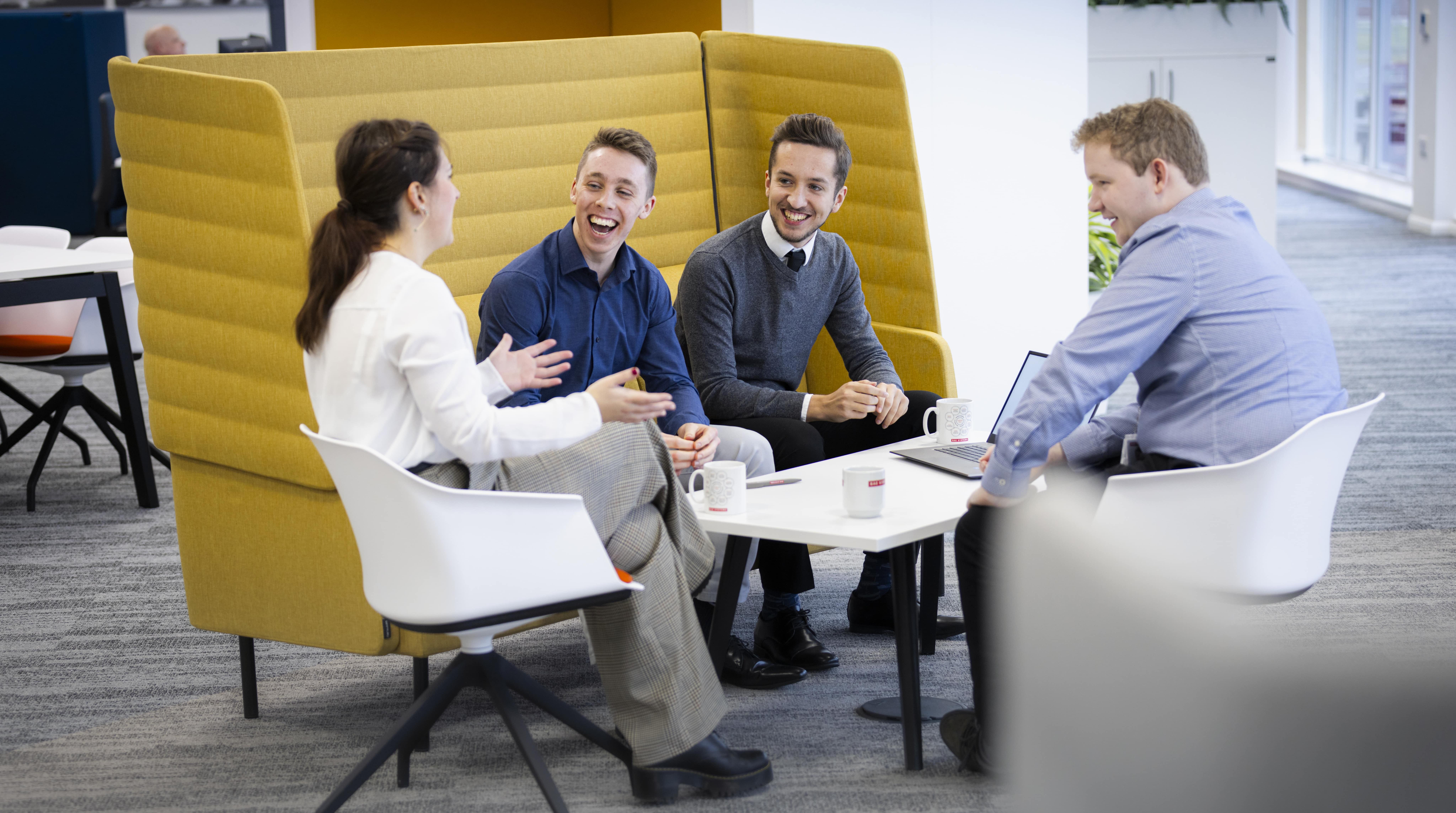Four marketing colleagues having a meeting at BAE Systems