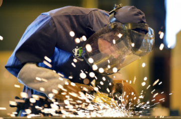 A BAE Systems welding professional at work in Govan Shipyard