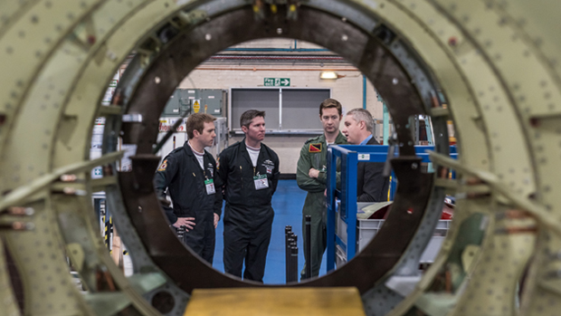 Flt Lts Ben Polwin and Toby Keeley with Deputy Team Manager, Flt Lt Al Branston on the Hawk manufacturing line
