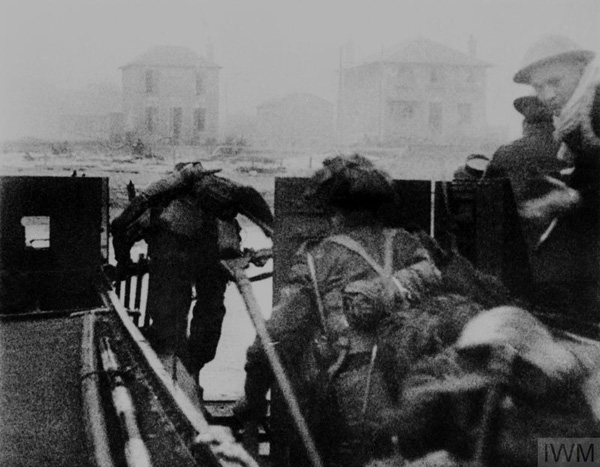 Canadian troops of the North Shore (New Brunswick) Regiment, 8th Canadian Infantry Brigade, 3rd Canadian Infantry Division, disembark from an LCA (Landing Craft Assault) onto Nan Red beach. Credit: Imperial War Museum