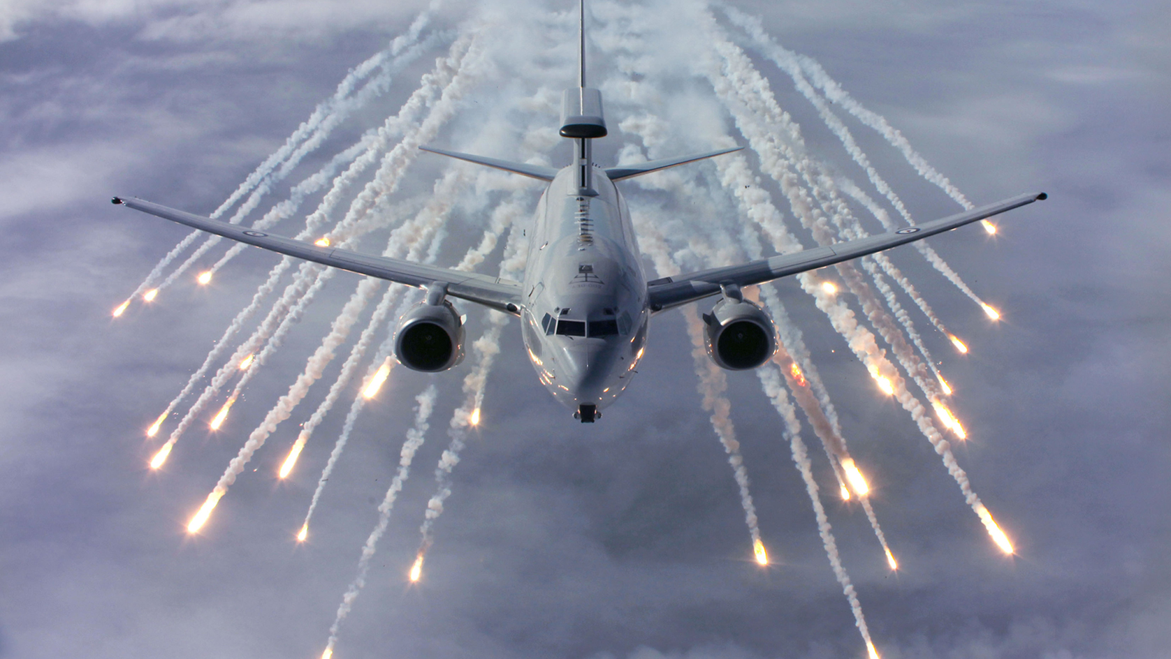 Wedgetail surveillance aeroplane firing decoy flares