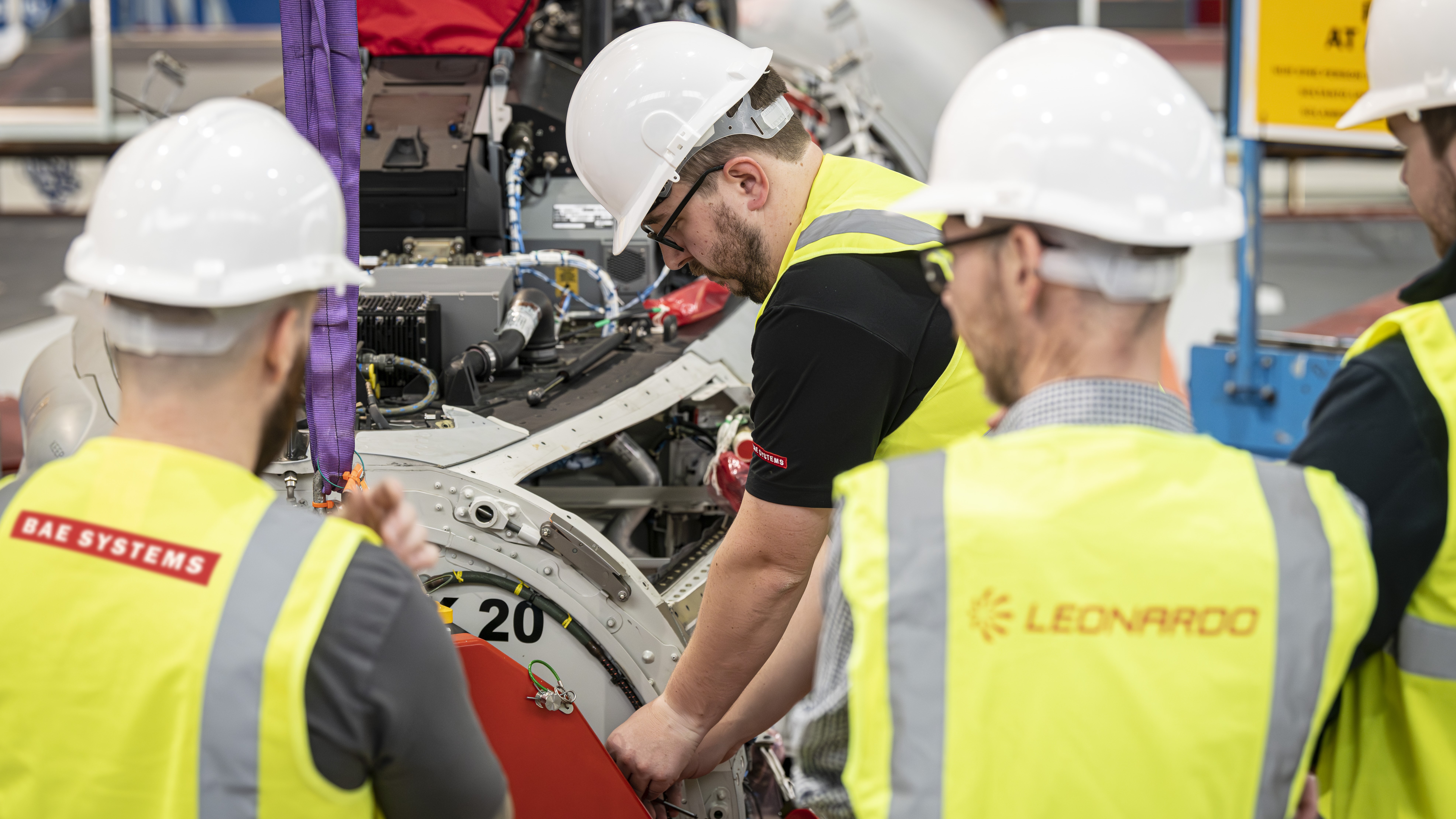 Engineers installing the ECRS Mk2 radar in to a Eurofighter Typhoon