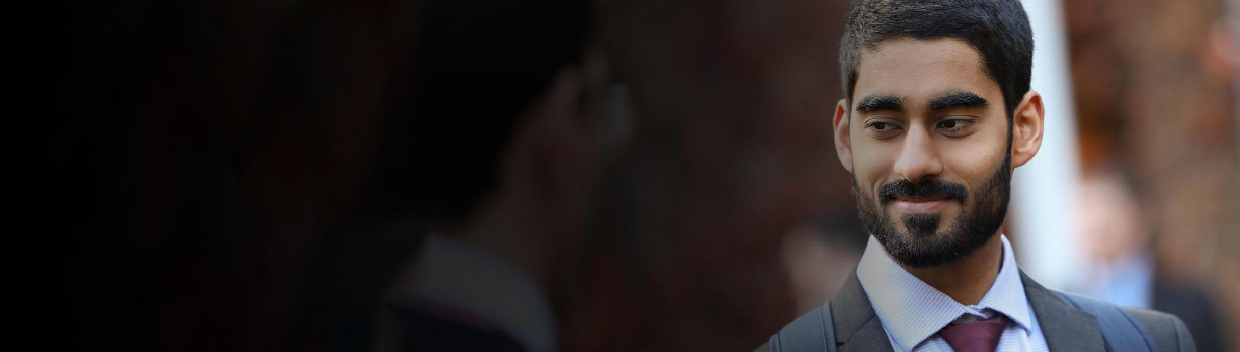 Smiling employee in a suit