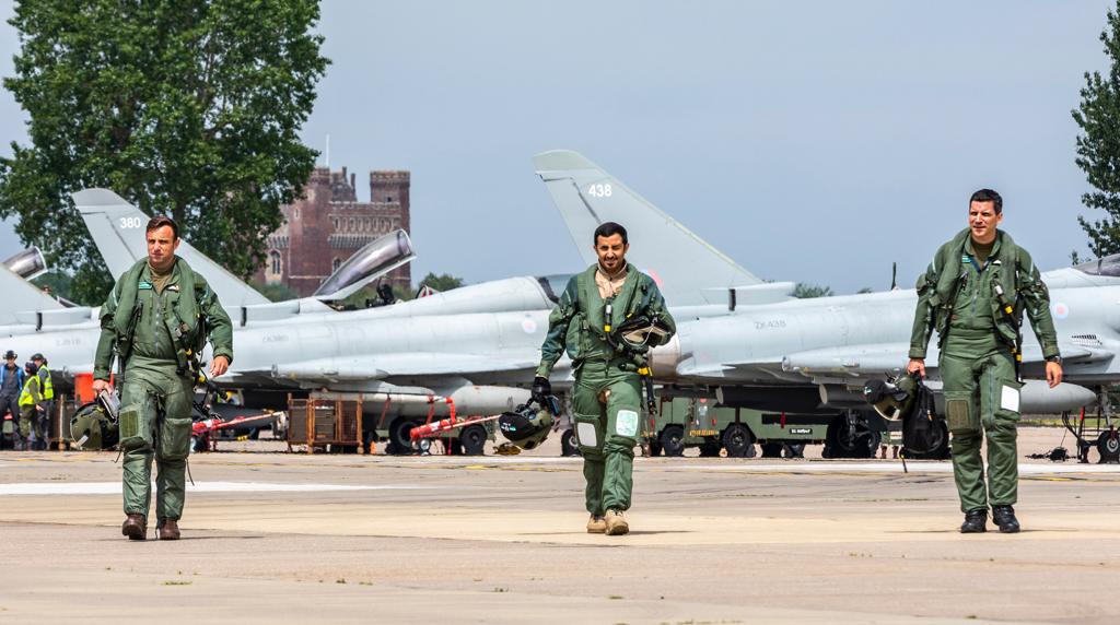 Qatar Emiri Air Force walking with Typhoons in the background