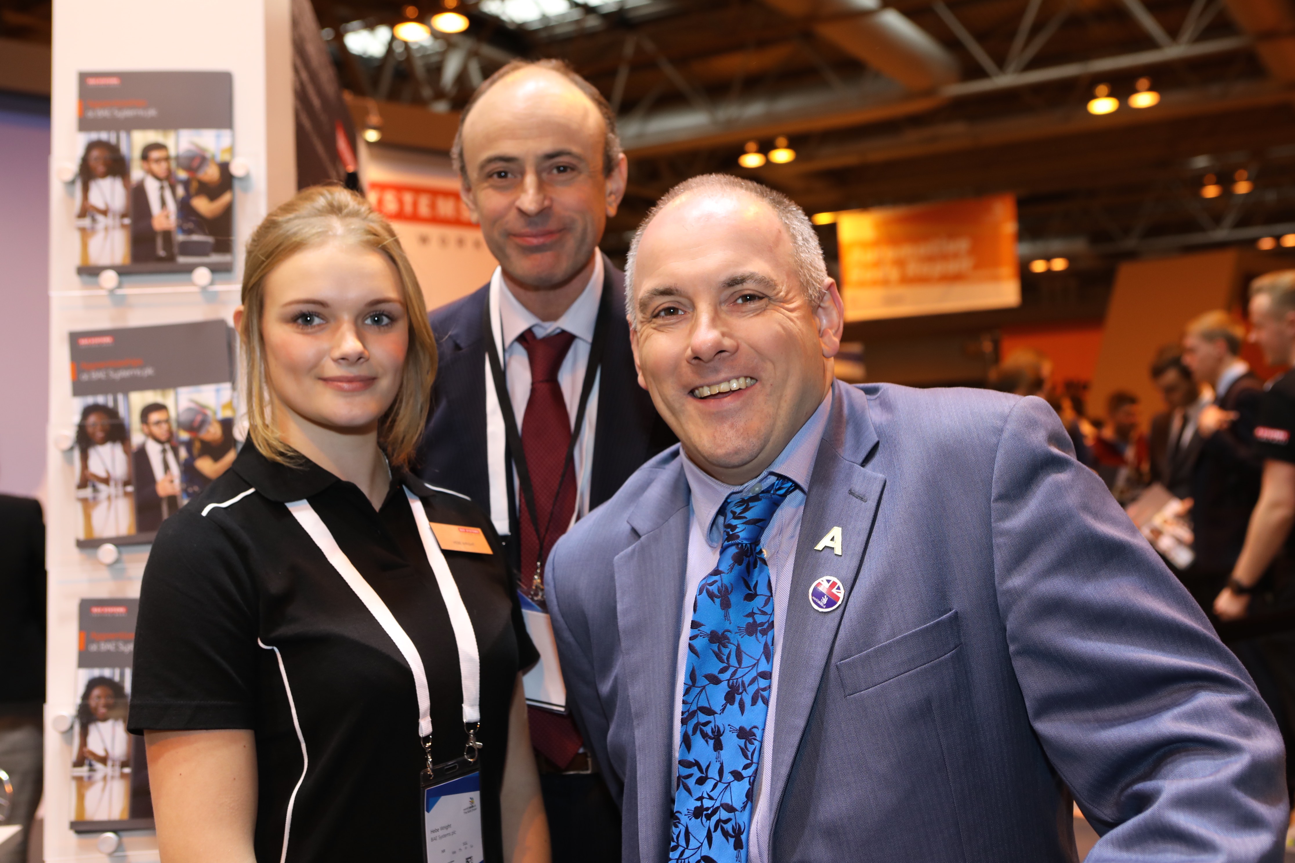 Skills Minister Robert Halfon with Richard Hamer, Skills and Education Director BAE Systems and BAE Systems apprentice Hebe Wright
