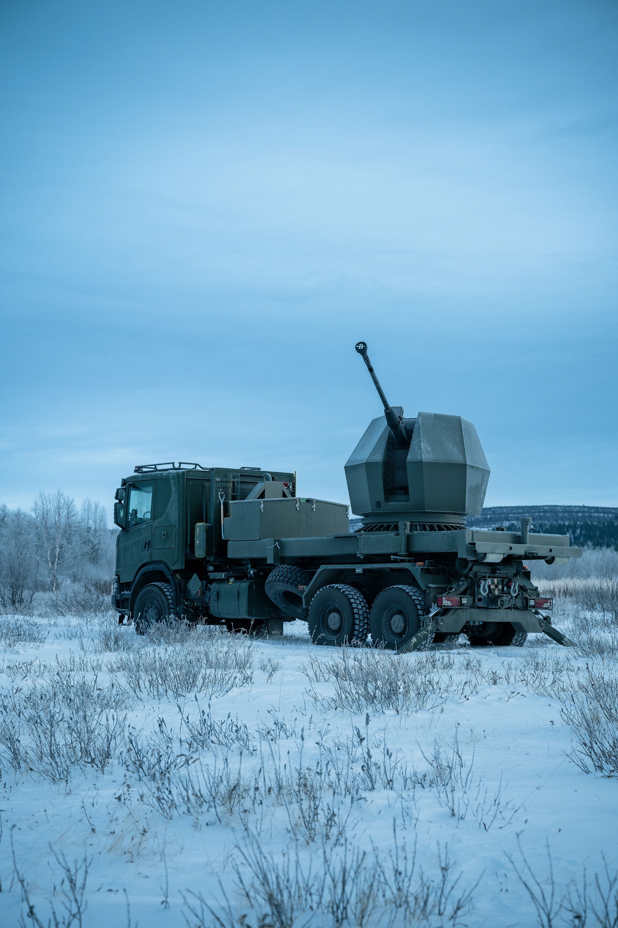 TRIDON Mk2 vehicle standing in a snowy landscape under harsh winter condition.