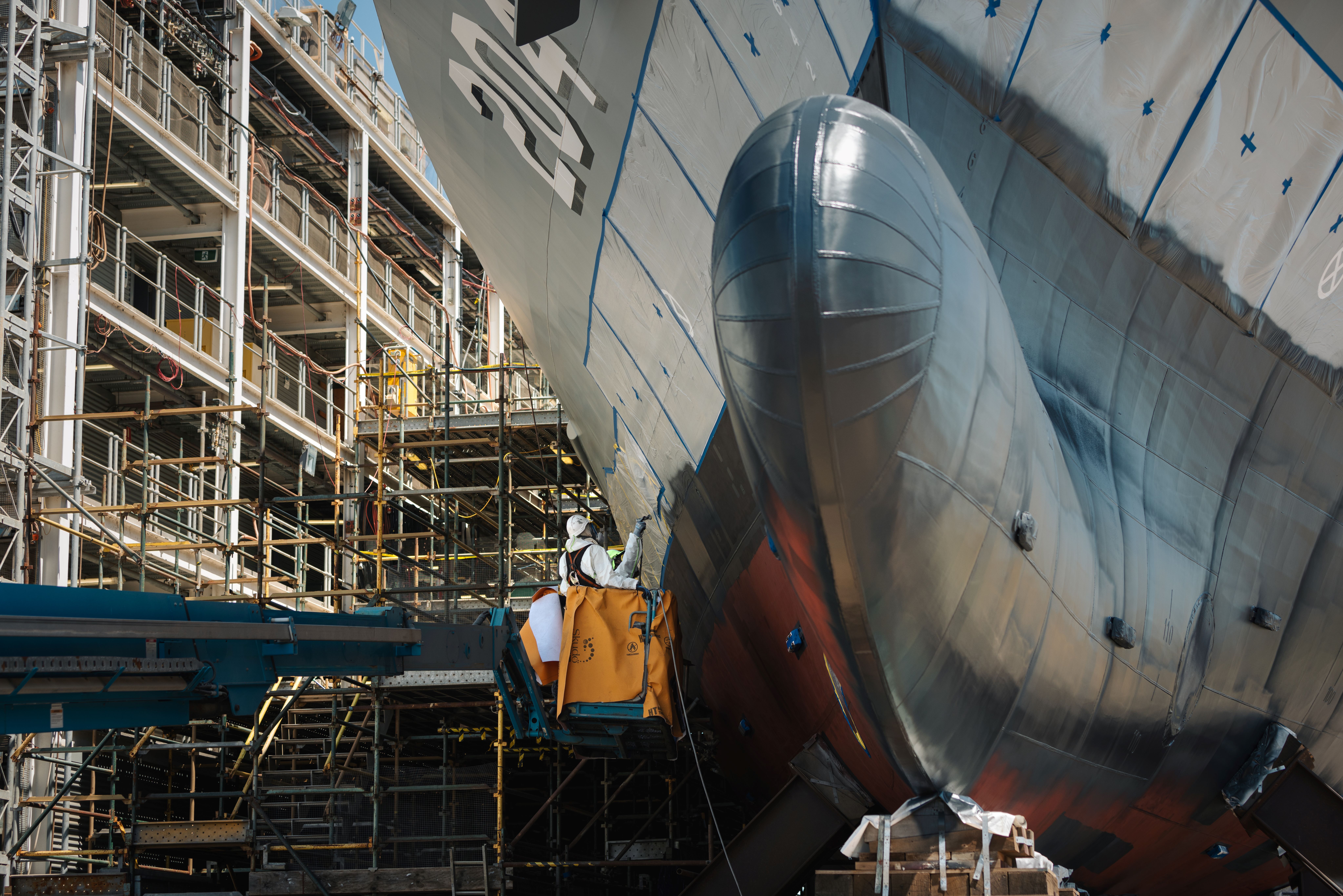 Eptec Defence Solutions abrasive blast and paint on the bottom section of a ship