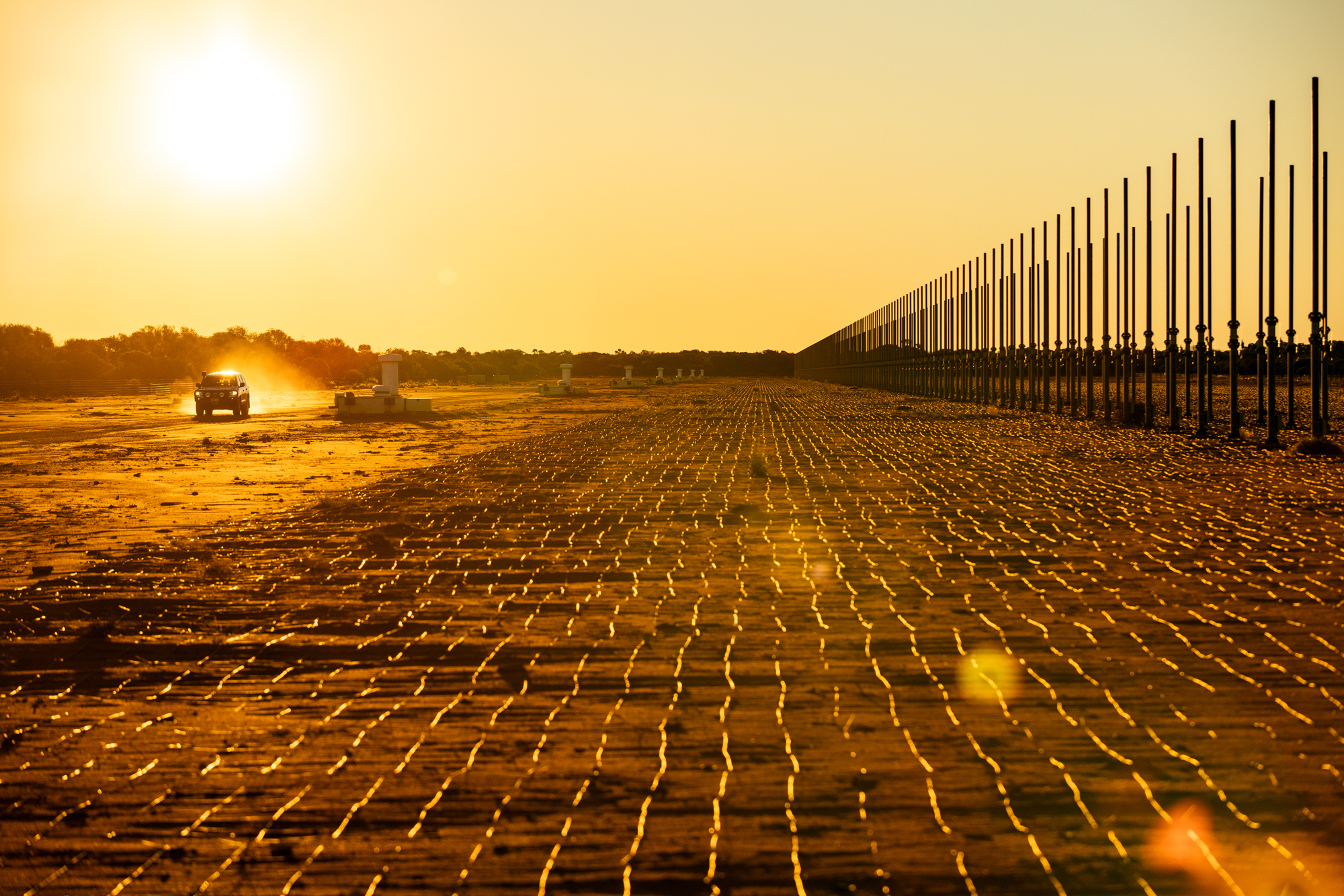 Photograph of JORN radar in the late afternoon in outback Australia, low sun, bright yellow and earthy colours