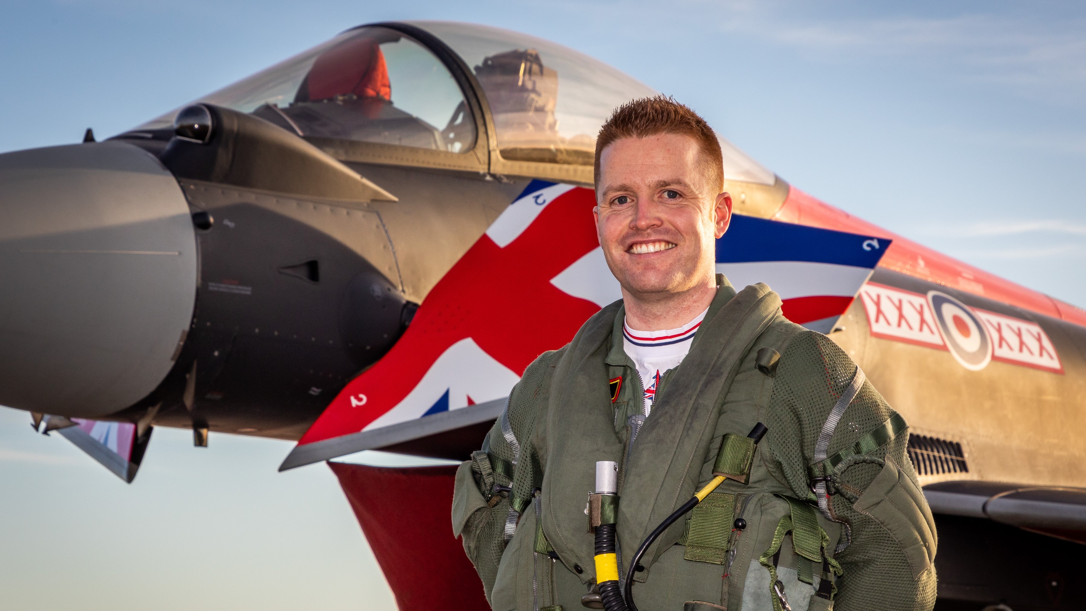 2022 Typhoon Display Pilot shakes hands with 2021 Typhoon Display Pilot 