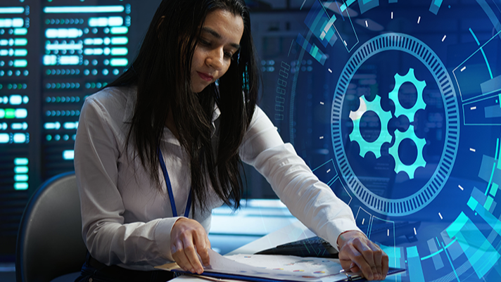 Image of a woman working in cyber threat detection tile