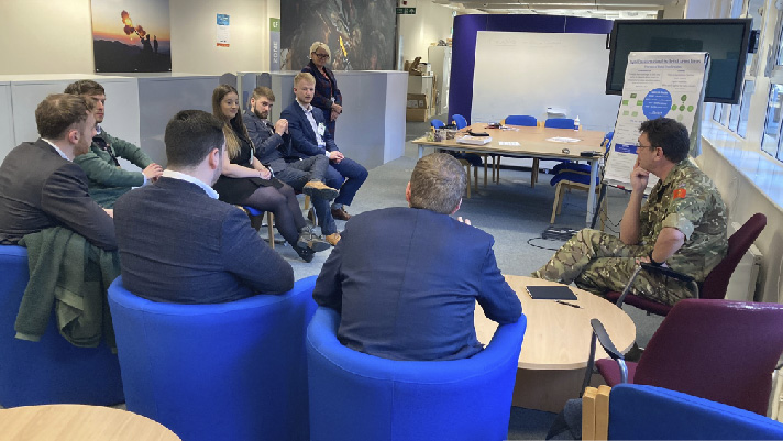 Harriet Wheeler and the BAE Systems team presenting to Colonel Ian Large, with British Army challenge sponsor, Sally Wareham MBCS FdA