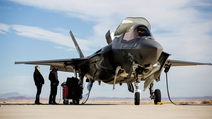 A group of engineers work on an F-35