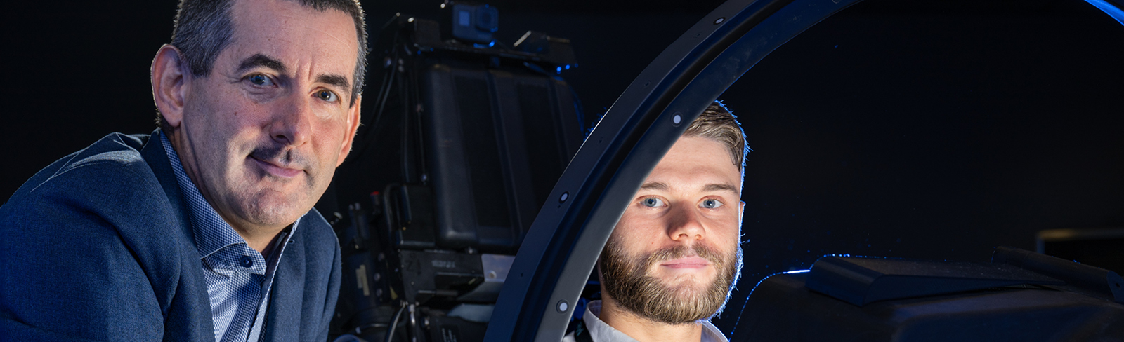 Mike Frank and Tom Dickie in a Eurofighter Typhoon cockpit simulator