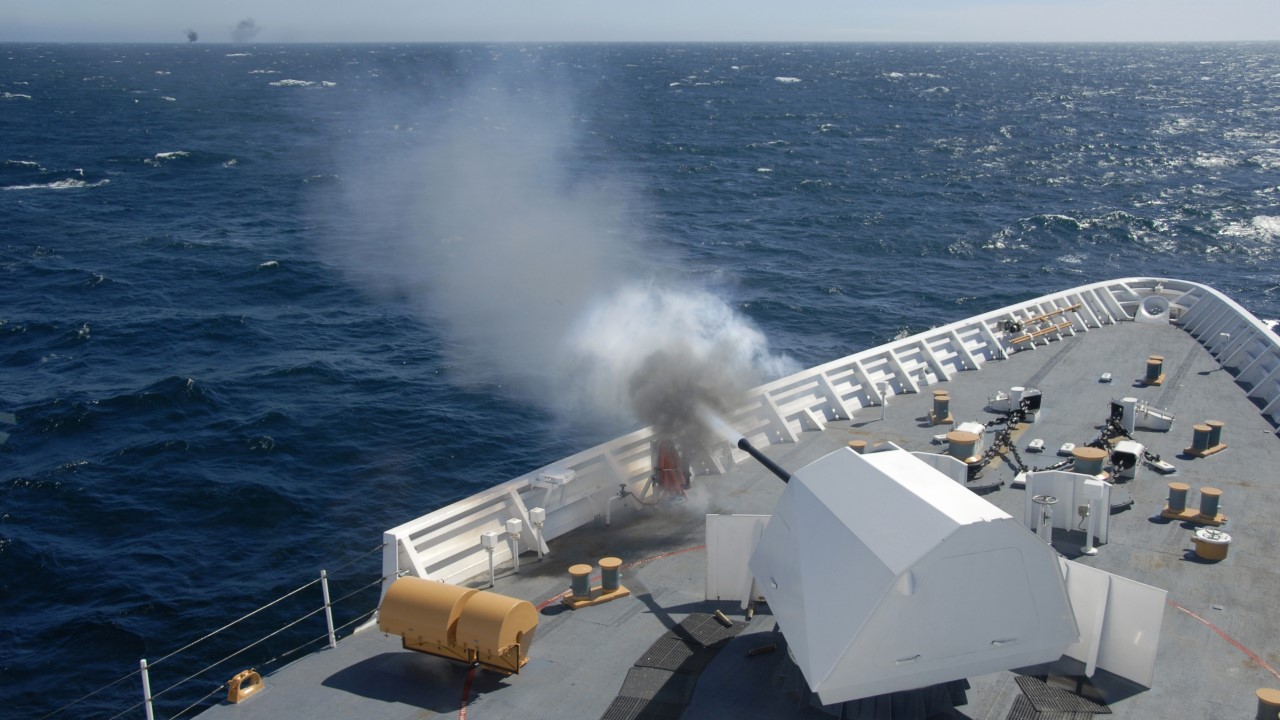 Coast Guard Cutter BERTHOLF's 57mm gun fires at an unmanned aerial vehicle drone. (U.S. Coast Guard photo.)