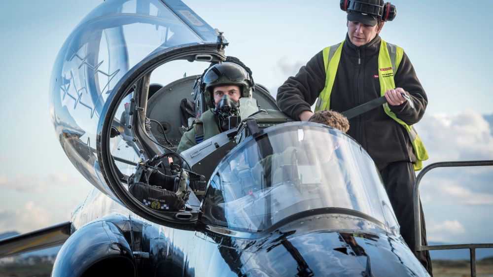 Pilot prepares for flight in cockpit