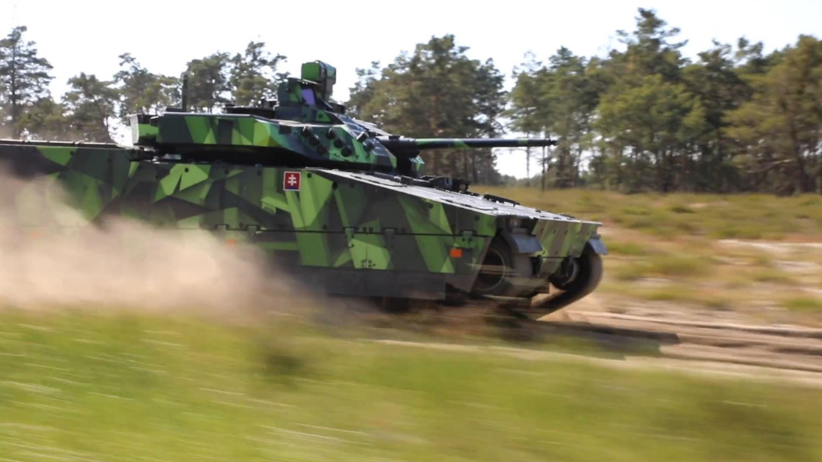CV90 driving down a dirt road