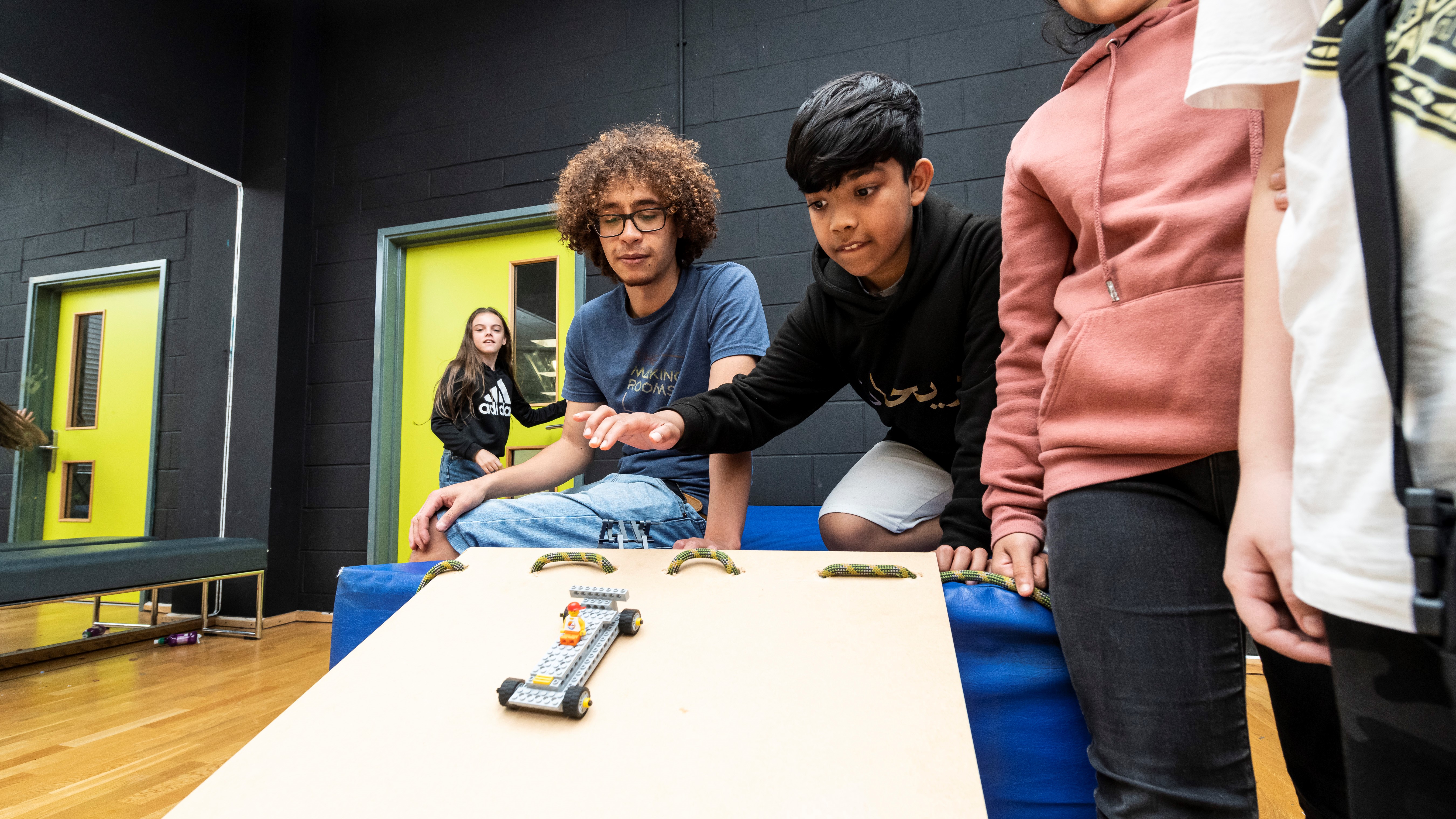 Young people carrying out experiment at Blackburn & Darwen Youth Zone