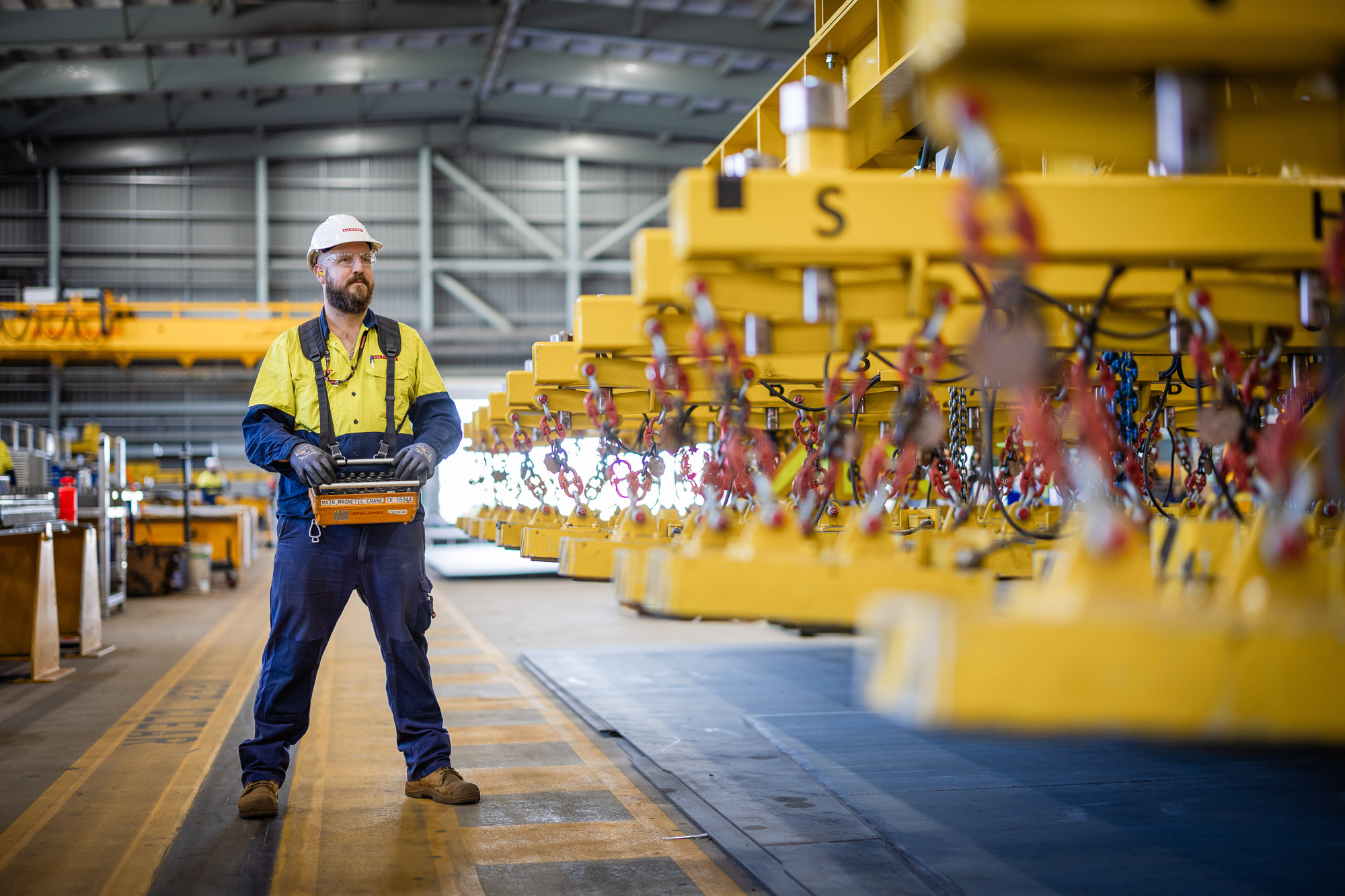 Shipbuilder operates machinery at the Osborne Naval Shipyard