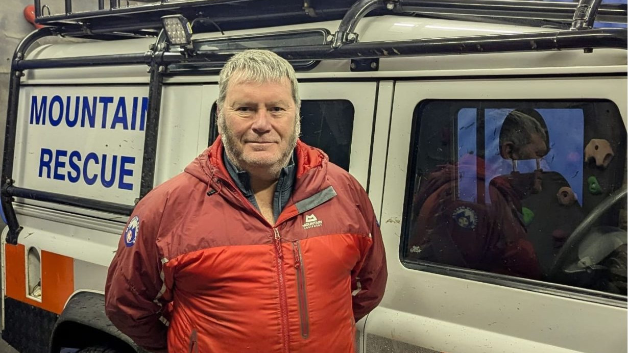 Kevin standing in front of Mountain Rescue Van