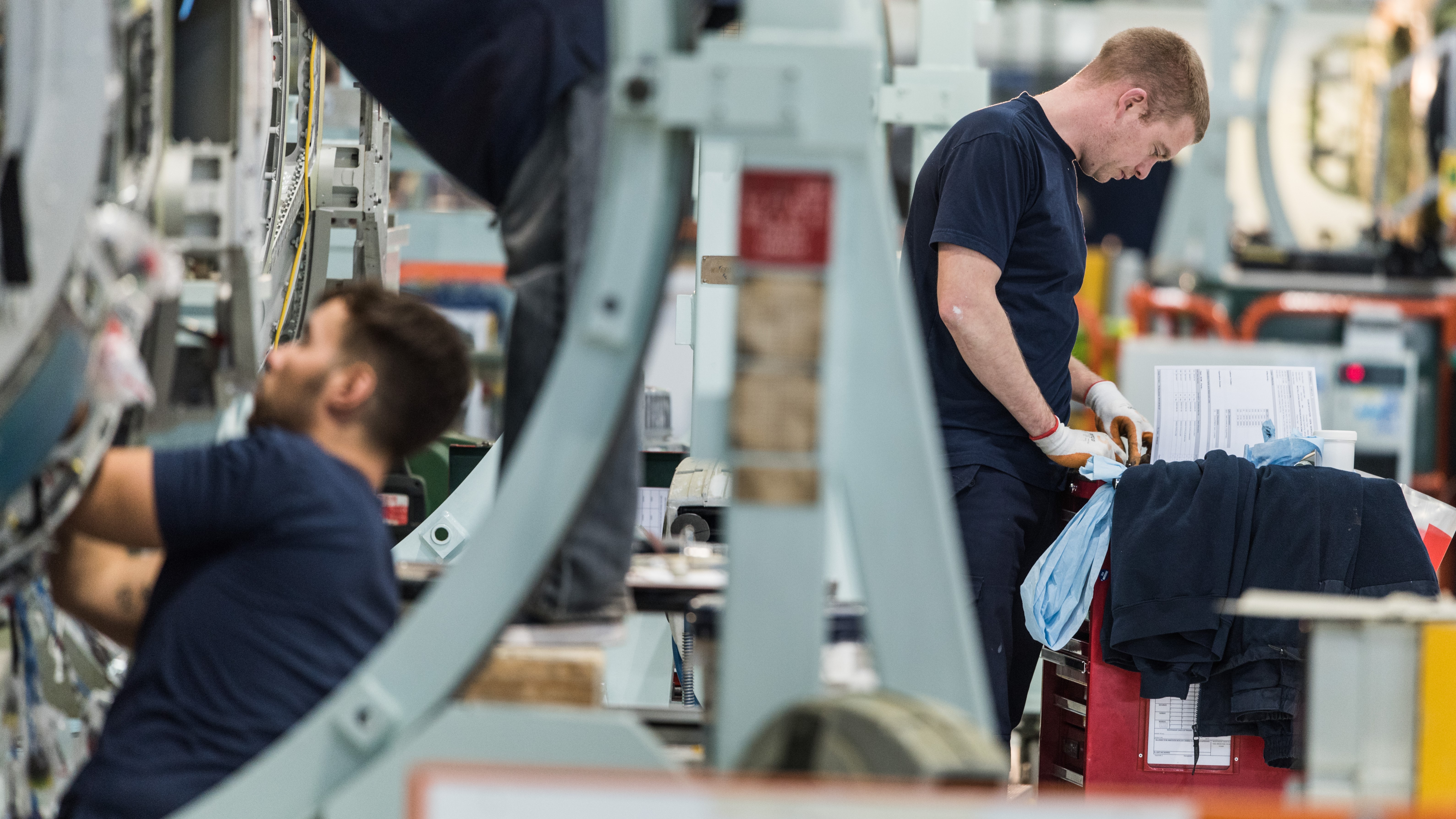 Two workers in the Typhoon Major Units production facility at BAE Systems in Lancashire, UK