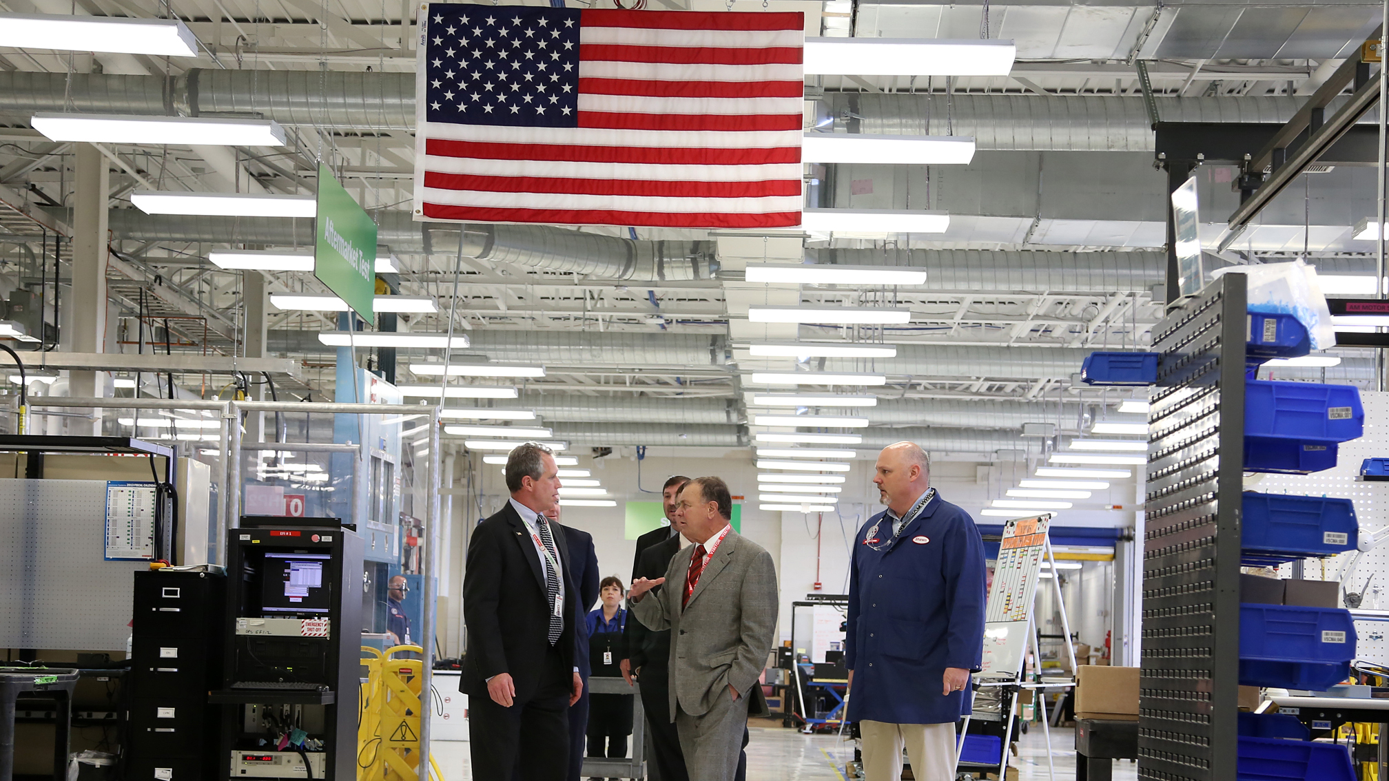U.S. Representative Richard Hanna tours Endicott, New York’s HybriDrive Solutions operations floor with BAE Systems leaders
