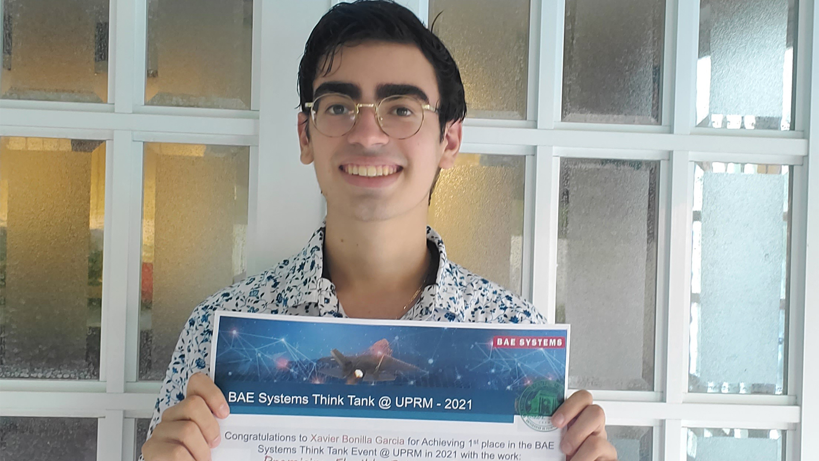 Xavier Bonilla Garcia, a student at University of Puerto Rico, shares his certificate as first place winner of the BAE Systems Think Tank competition.