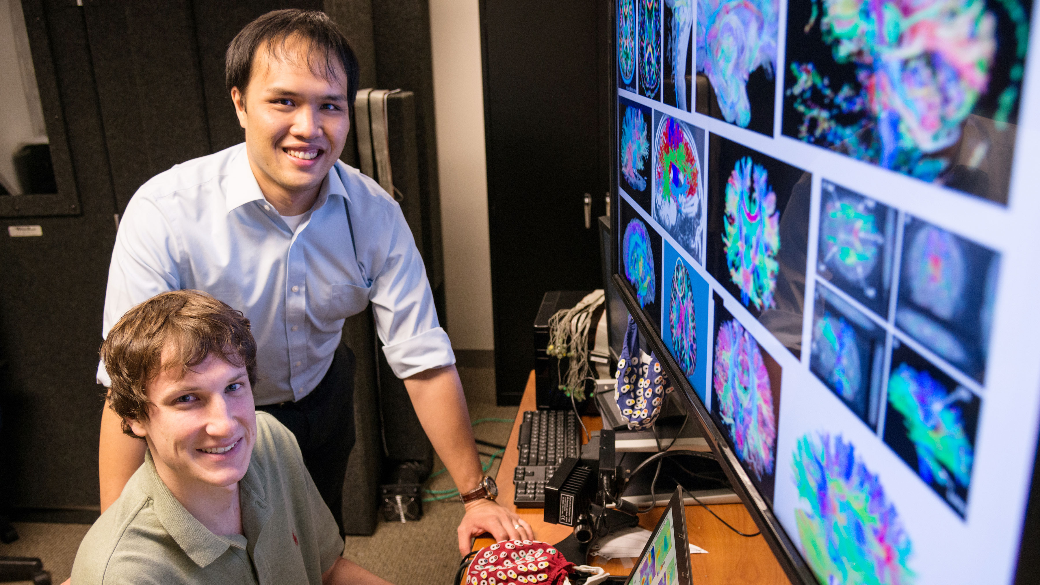 Scott Kuzdeba and Troy Lau, research engineers at BAE Systems and winners of the IARPA INSTINCT challenge look at brain imaging that helped choose algorithms to employ in the challenge.
